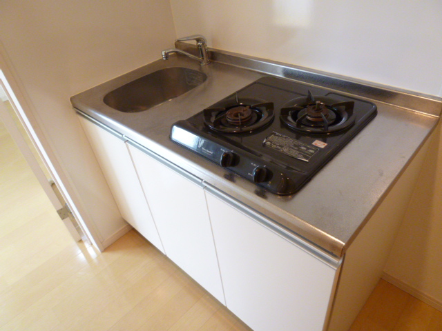 Kitchen. It comes with a two-burner stove