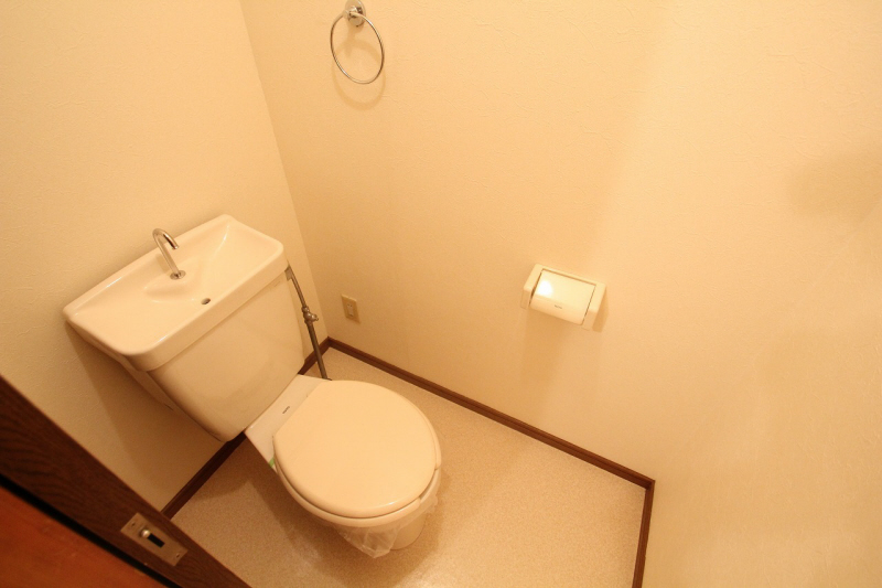 Toilet. It is a photograph of the 302 in Room