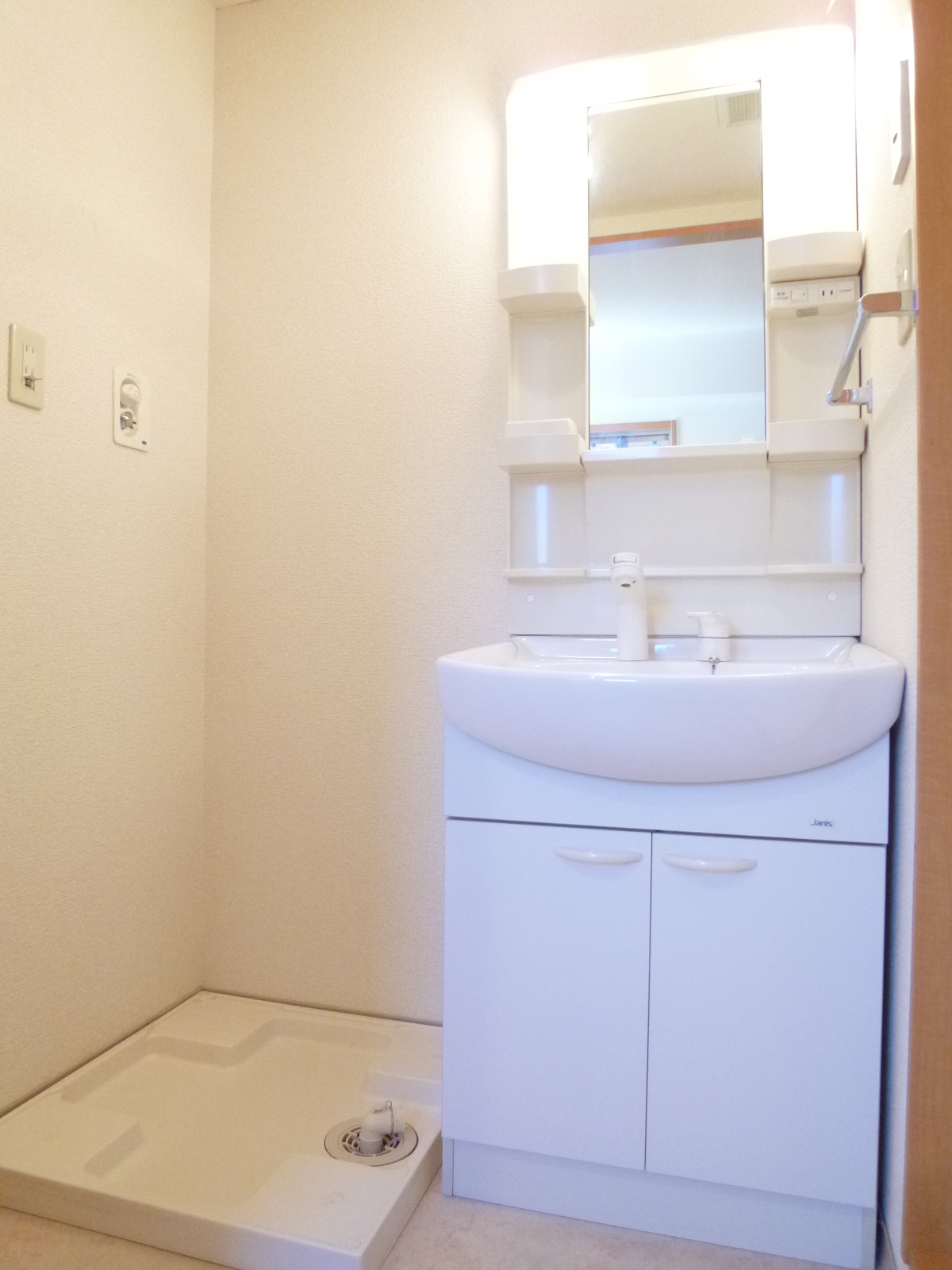Washroom. Lavatory, complete with handy shower dresser morning. 