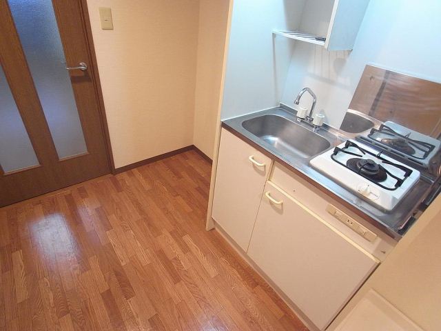 Kitchen. There is also a refrigerator space.