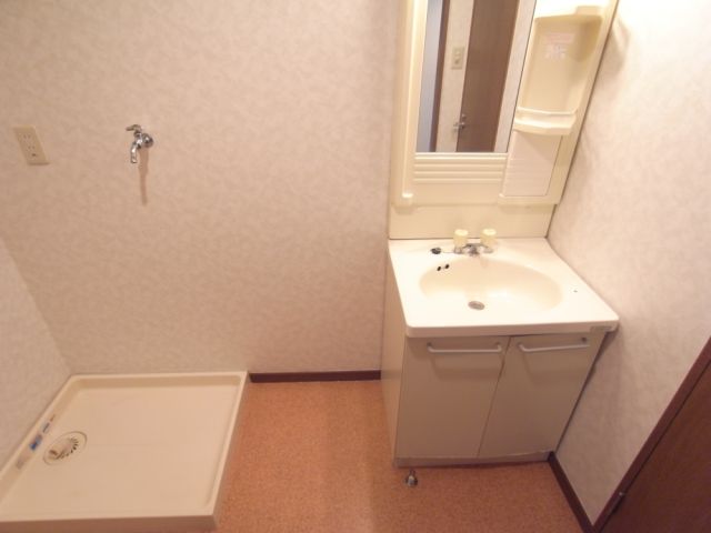 Washroom. There is a separate wash basin.