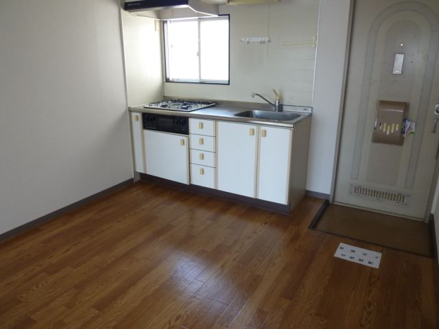 Living and room. There is a kitchen to the front door next to.
