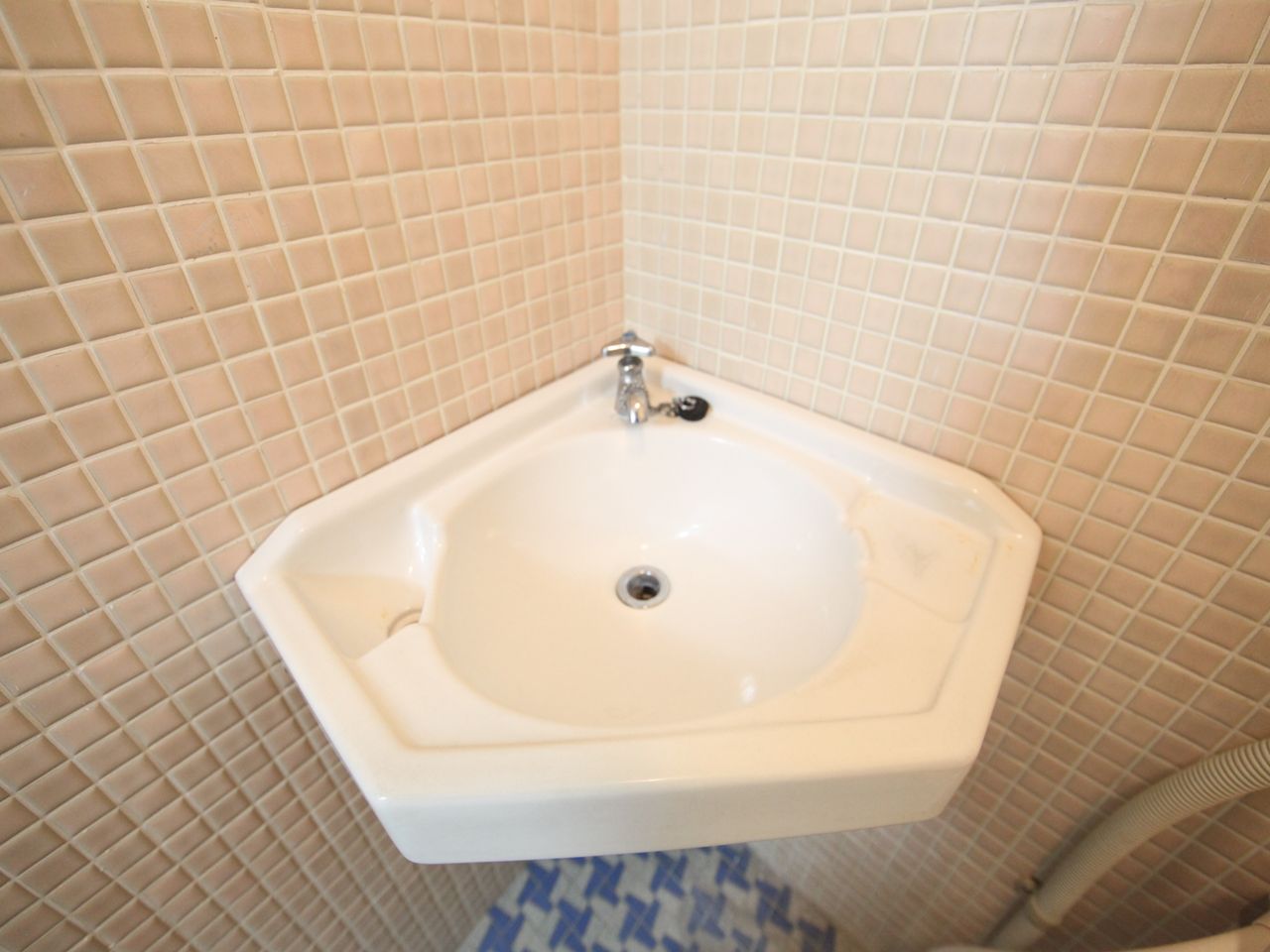 Washroom. Wash basin and with a mirror in the bathroom