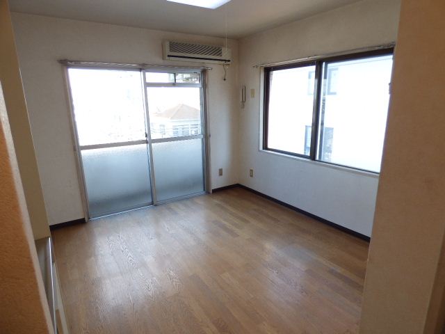 Living and room. It is a bright room with two-sided window.