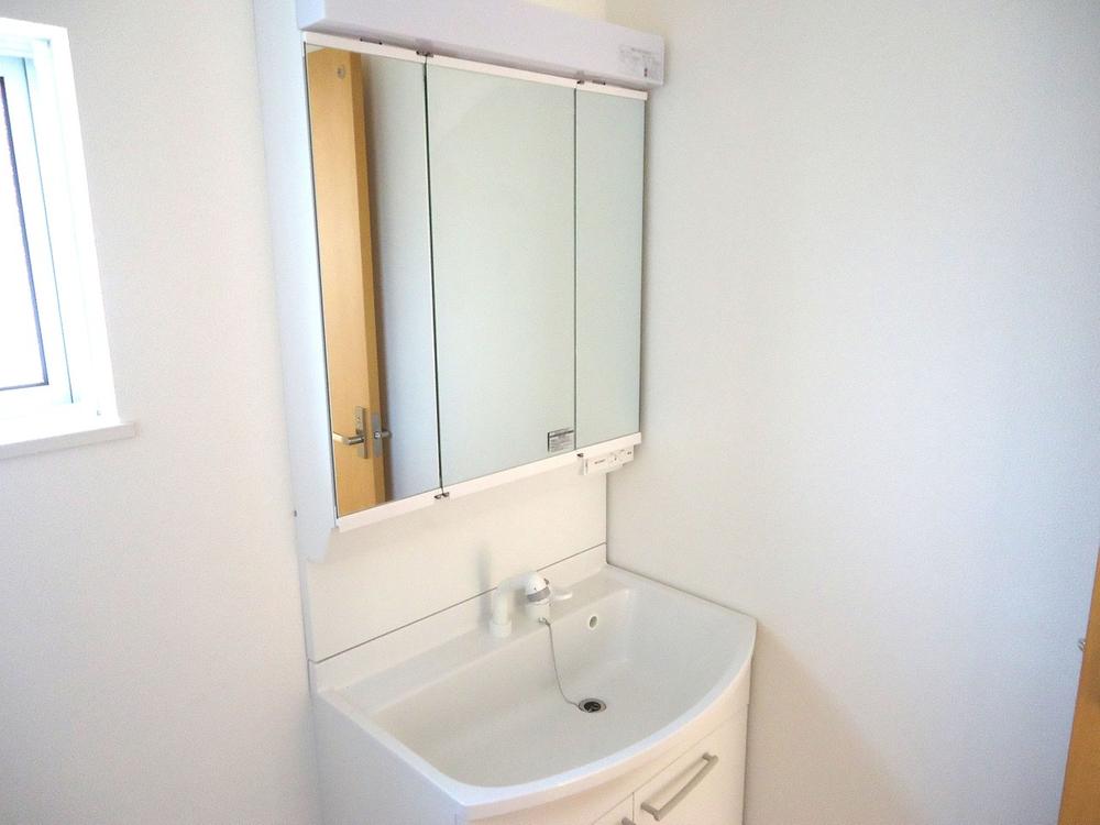 Wash basin, toilet. Vanity with a three-sided mirror shower