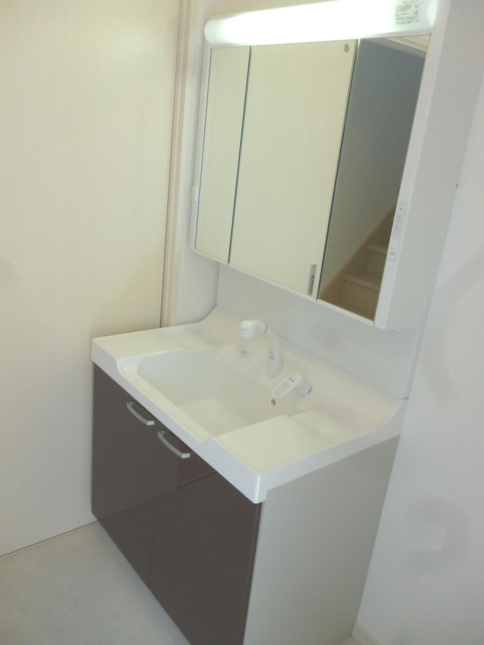 Wash basin, toilet. Shower