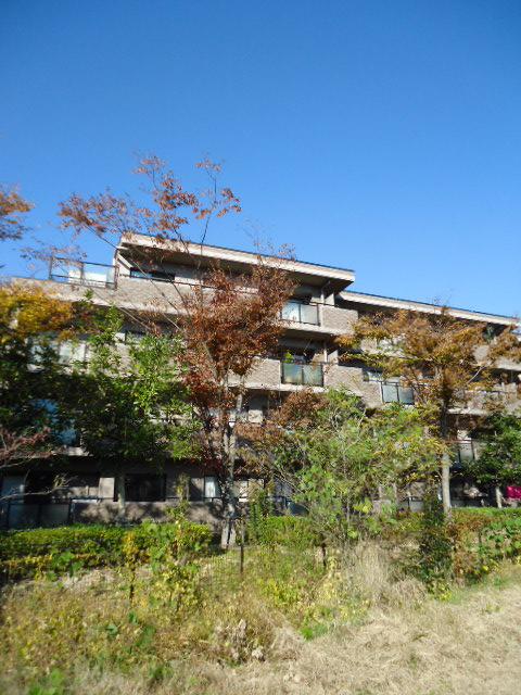 Local appearance photo. The building exterior is surrounded by green.