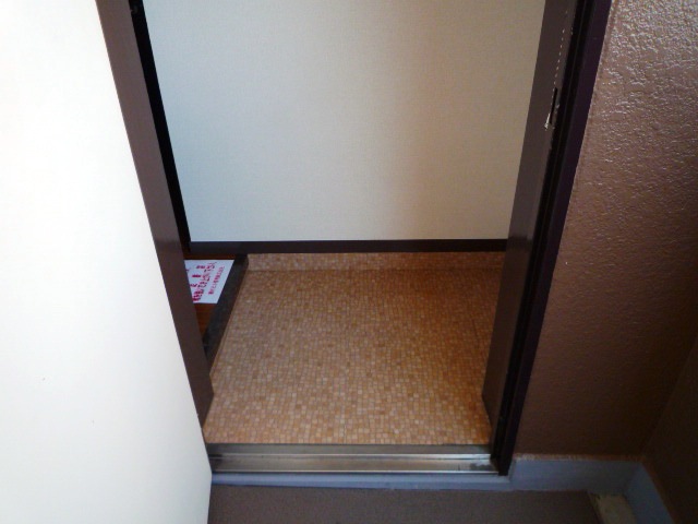 Entrance. The image is a separate room in the same property. It will honor the current state.