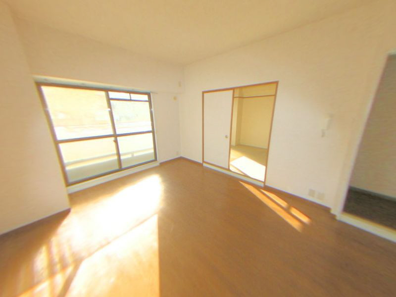 Other. Bright living room with bay windows also attached on the south-facing veranda