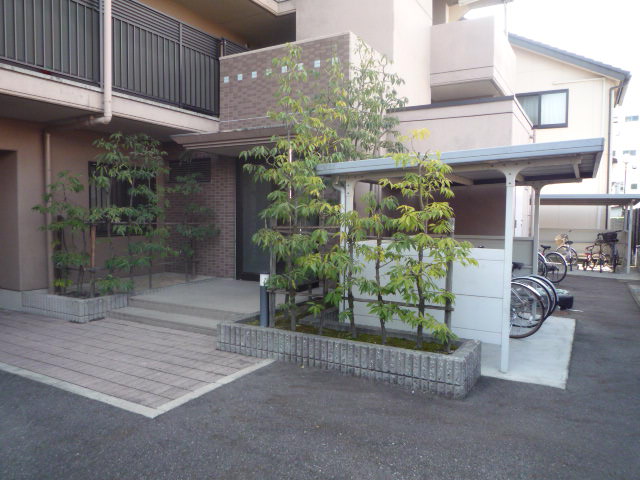 Entrance. Bicycle parking space is also neat