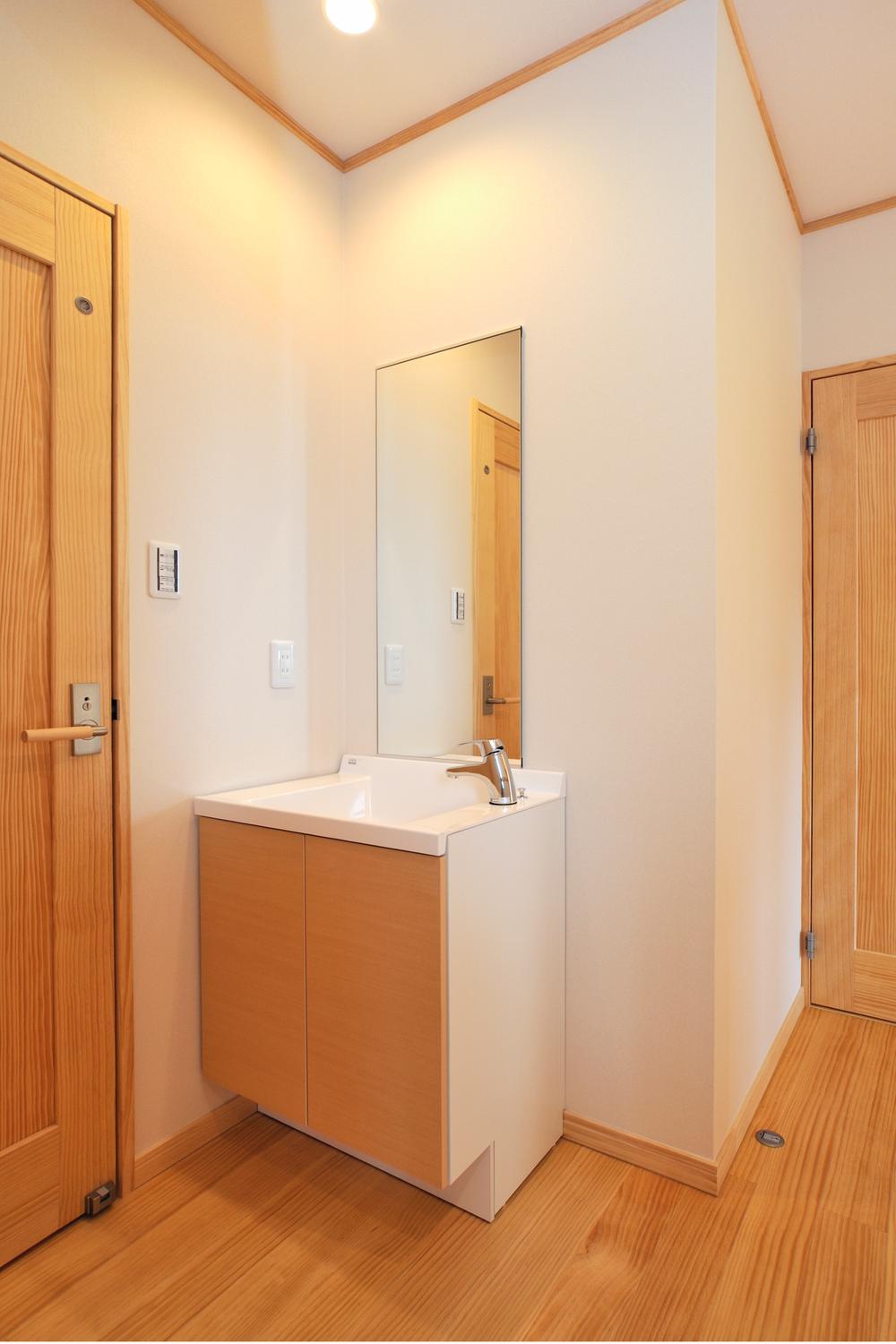 Wash basin, toilet. Second floor bathroom vanity