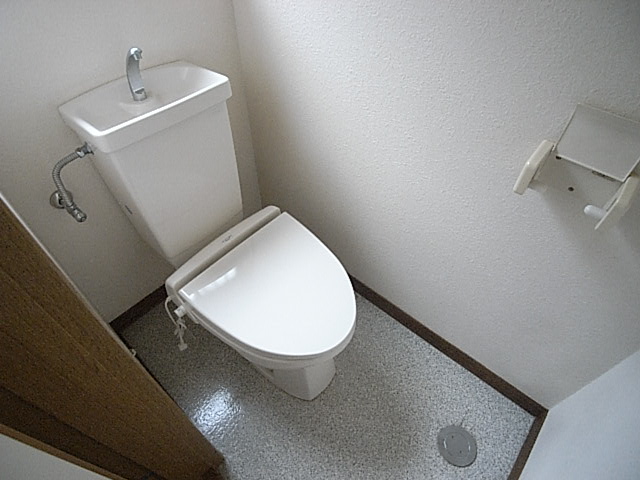 Toilet. It is bright because there is a window