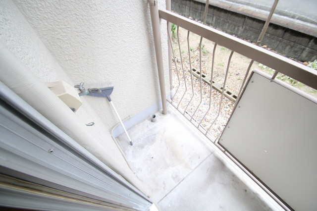 Washroom. Washing machine storage on balcony side. 