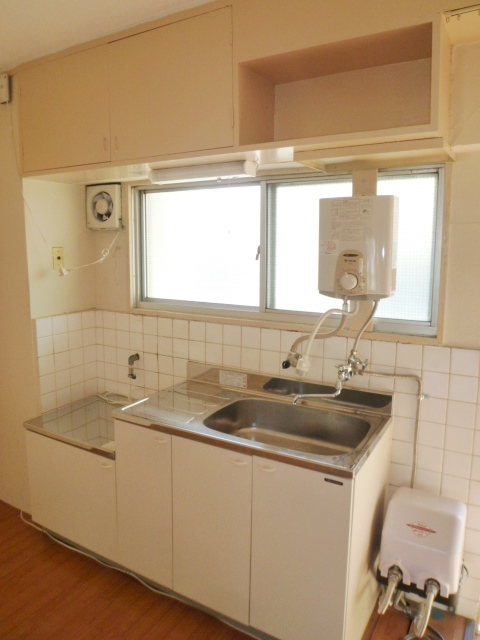 Kitchen. Window with two-burner gas stove can be installed kitchen