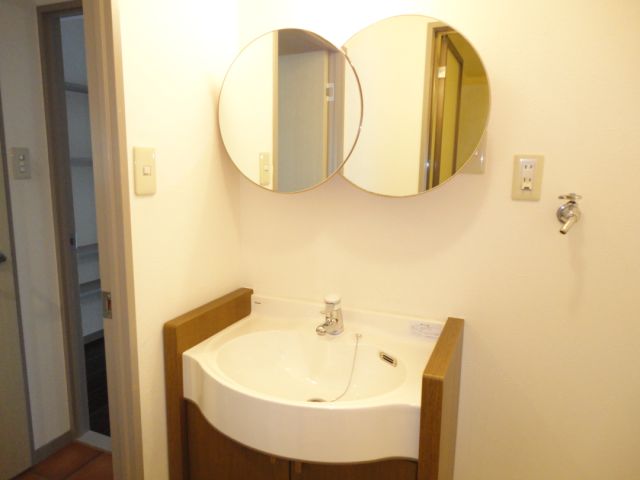 Washroom. Washbasin round mirror fashionable