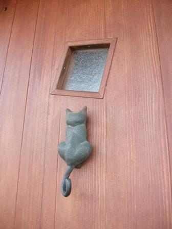 Entrance. Cute cat motif to the entrance door