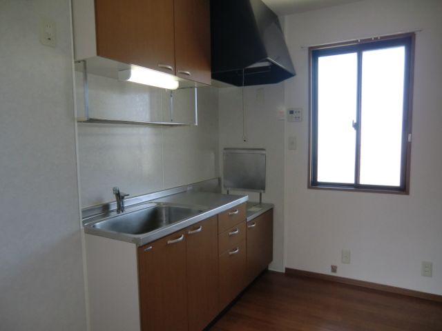 Kitchen. It is bright because there is a window also near the kitchen.