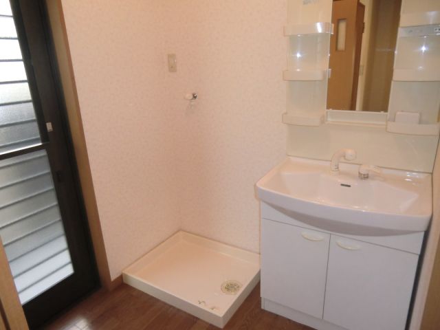 Washroom. Vanity &-room washing machine storage!