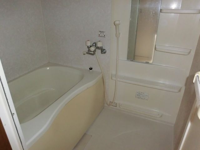 Bath. It is a bathroom with a small window!