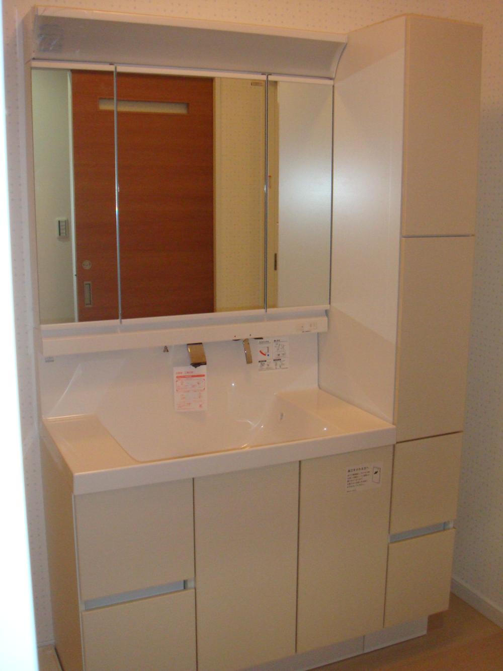 Wash basin, toilet. With tall cabinet. 