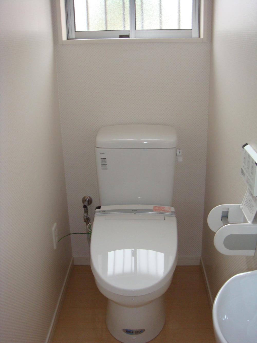 Toilet. Wash-basin another Washlet toilet. 