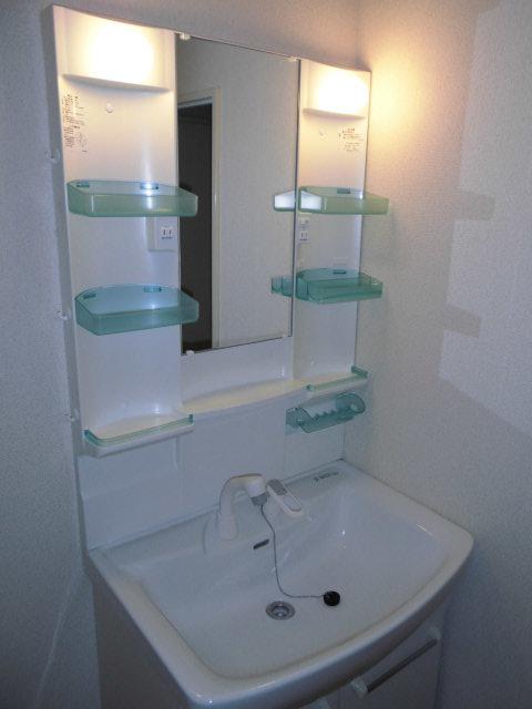 Wash basin, toilet. Vanity cleaned of