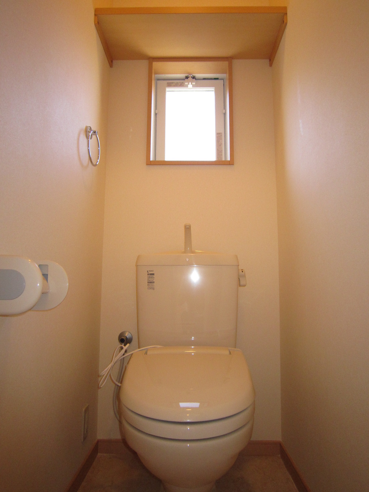 Toilet. Window with bright toilet