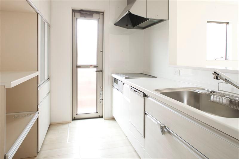 Kitchen. Kitchen where Building C kitchen cupboard was equipped is, Back door is also located happy design to wife.