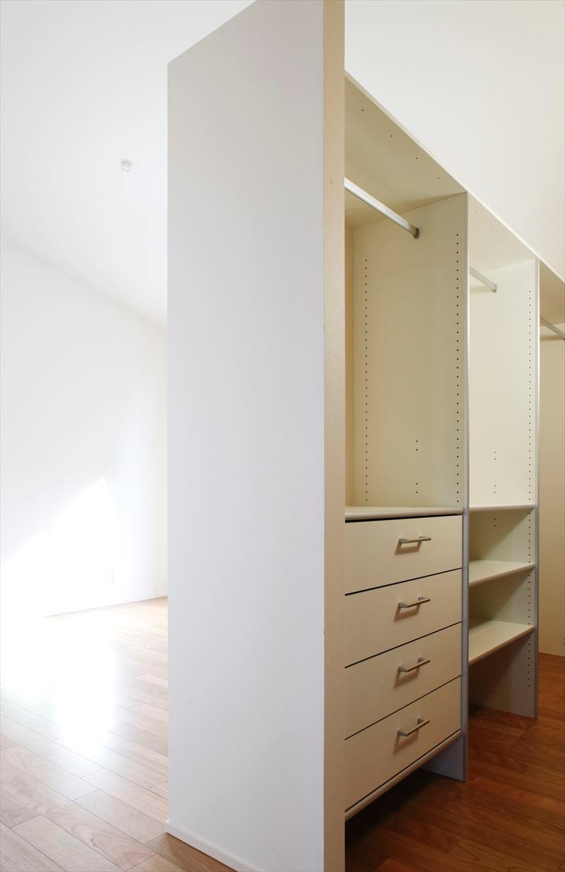 Walk-in closet of the building B walk-in closet wife to happy with the system storage. . Building B walk-in closet