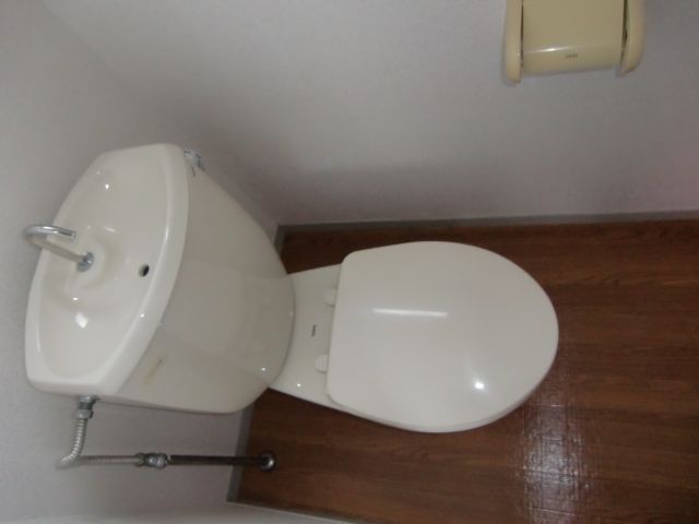 Toilet. It has a small window