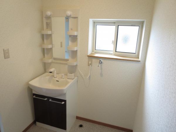 Wash basin, toilet. Vanity also is a new article. It is useful in the morning Shan because the shower hose.  Space to put the washing machine has also been secured properly.