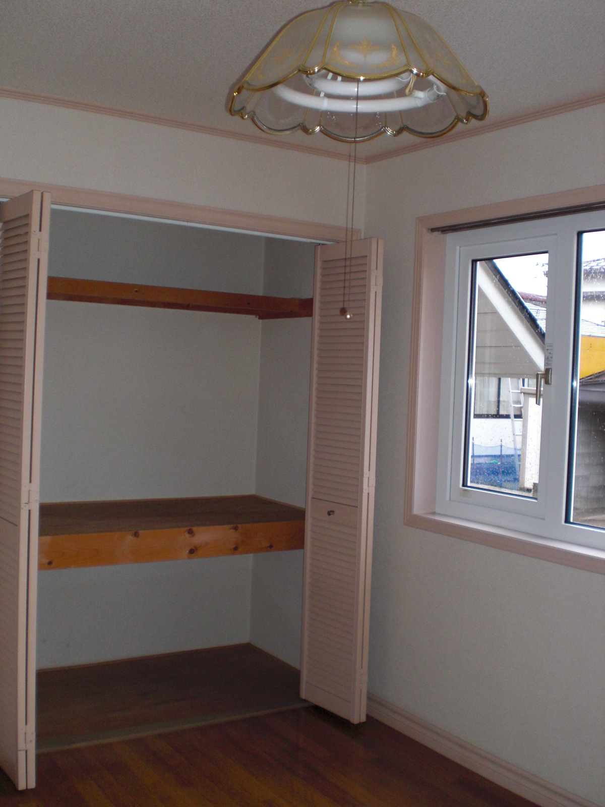 Other room space. There is a storage and large windows in the Western-style