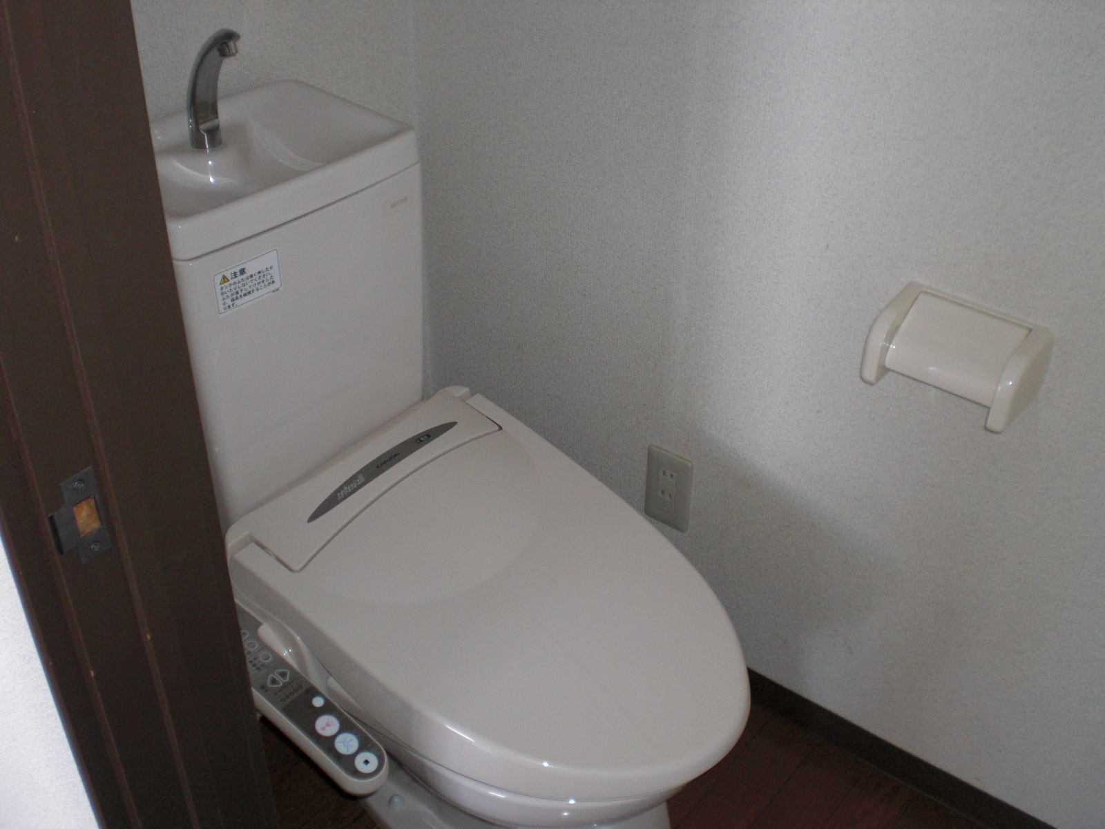 Toilet. Flush toilet with a warm water washing toilet seat