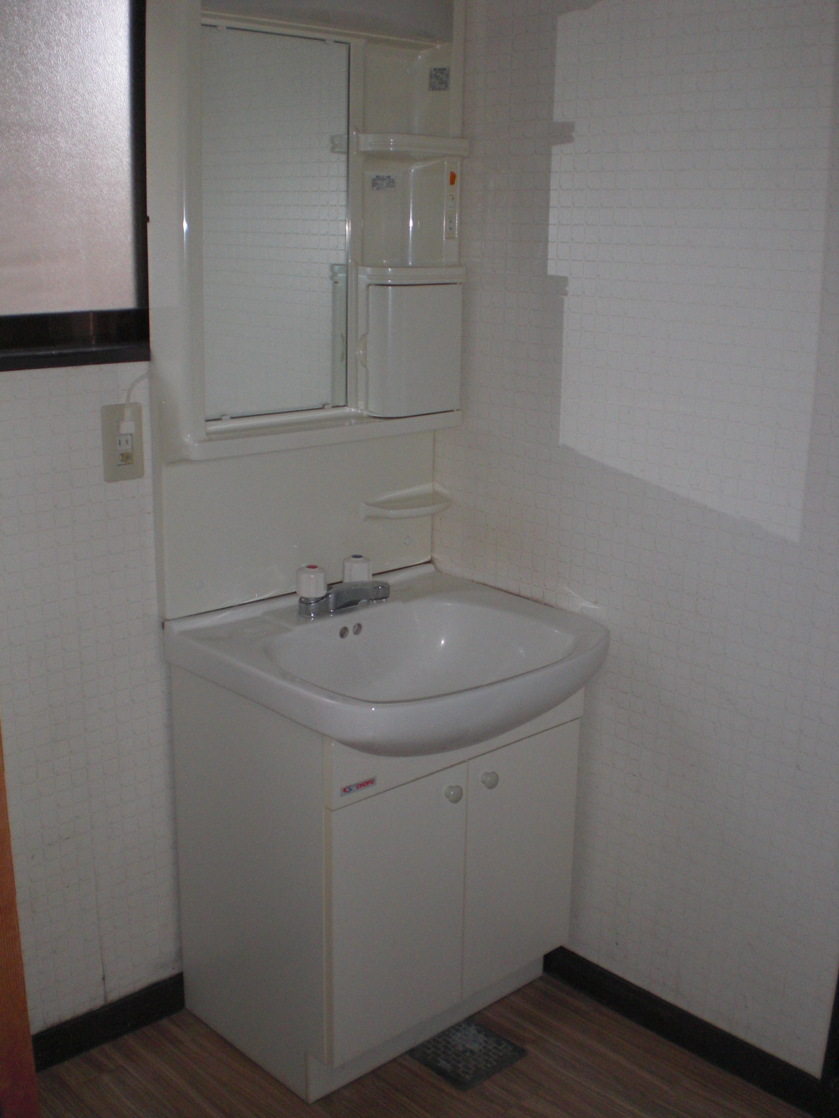 Washroom. There is a separate wash basin and washing machine Storage