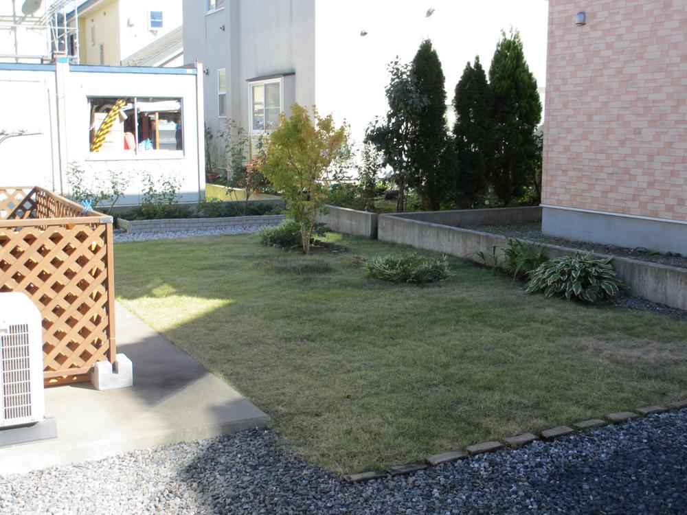 Other. It is beautifully laid lawn in the garden. It is a children's playground. 