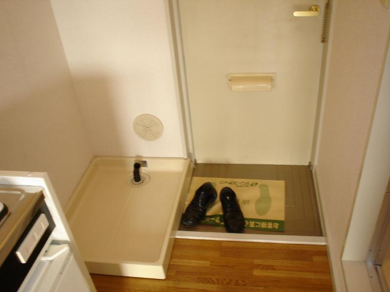 Entrance. There happy indoor washing machine storage can be found at the entrance of the room!