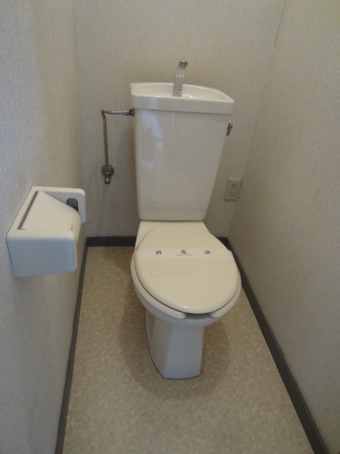 Toilet. It is housed with.
