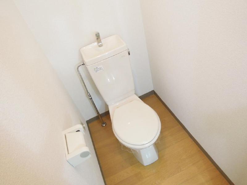 Toilet. White and is a space with a cleanliness