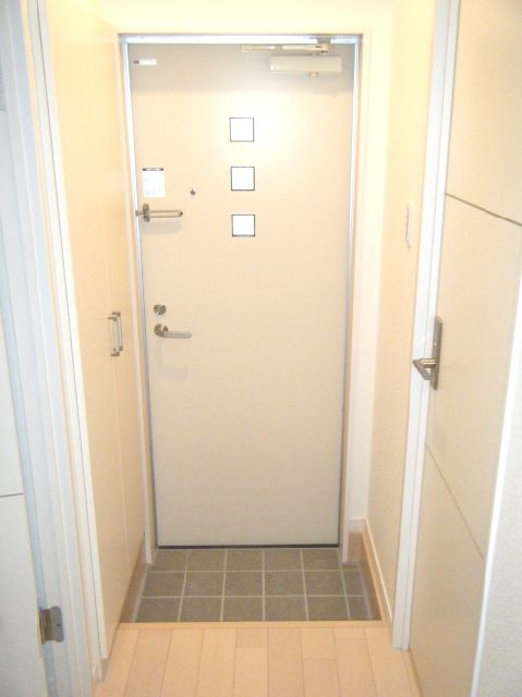 Entrance. It is a photograph of the other room.