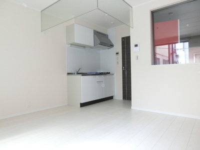 Living and room. It is a bright room with white-collar