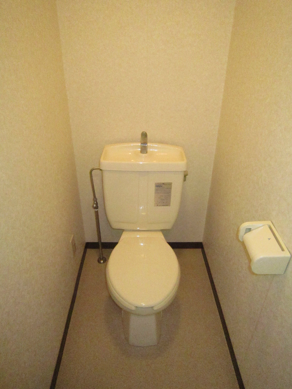 Toilet. It is a restroom with cleanliness.