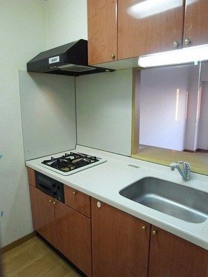 Kitchen. In face-to-face system kitchen the conversation is lively with family while the housework