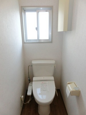 Toilet. There is a window in the toilet.