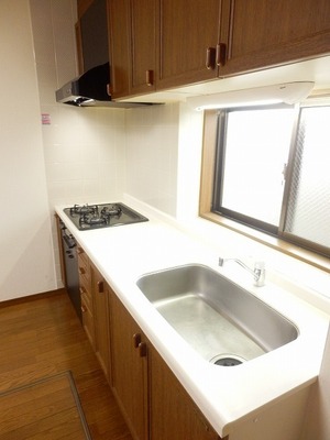 Kitchen. There is a window is very bright kitchen. Cooking space is also widely use wins
