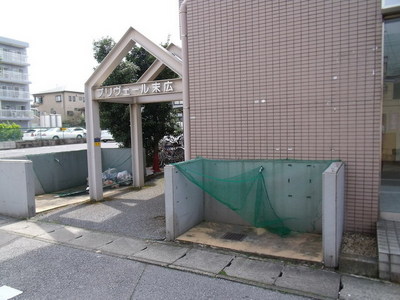 Entrance. On-site j waste storage