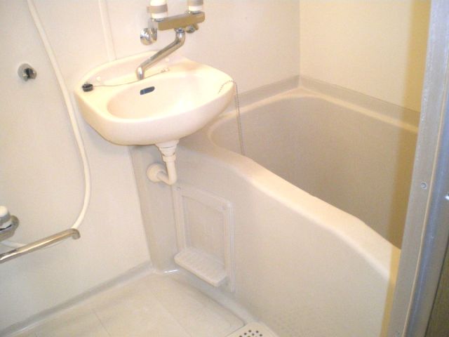 Bath. It is with wash basin bath