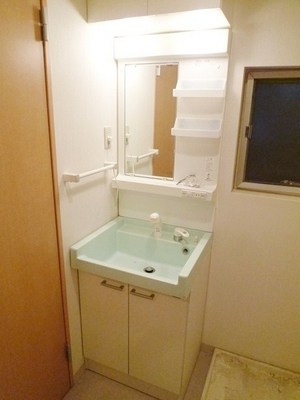 Washroom. Wash room with a small window that can ventilation. Shampoo is with Dresser.