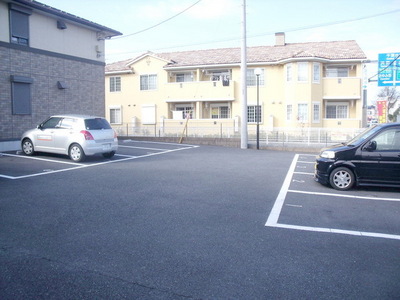 Entrance. Spacious parking space