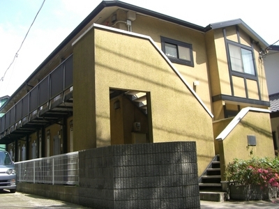 Building appearance. Appearance of the stairs side. Apartment of 2-story.