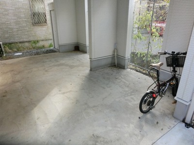 Parking lot. There is also bicycle parking space with a roof.